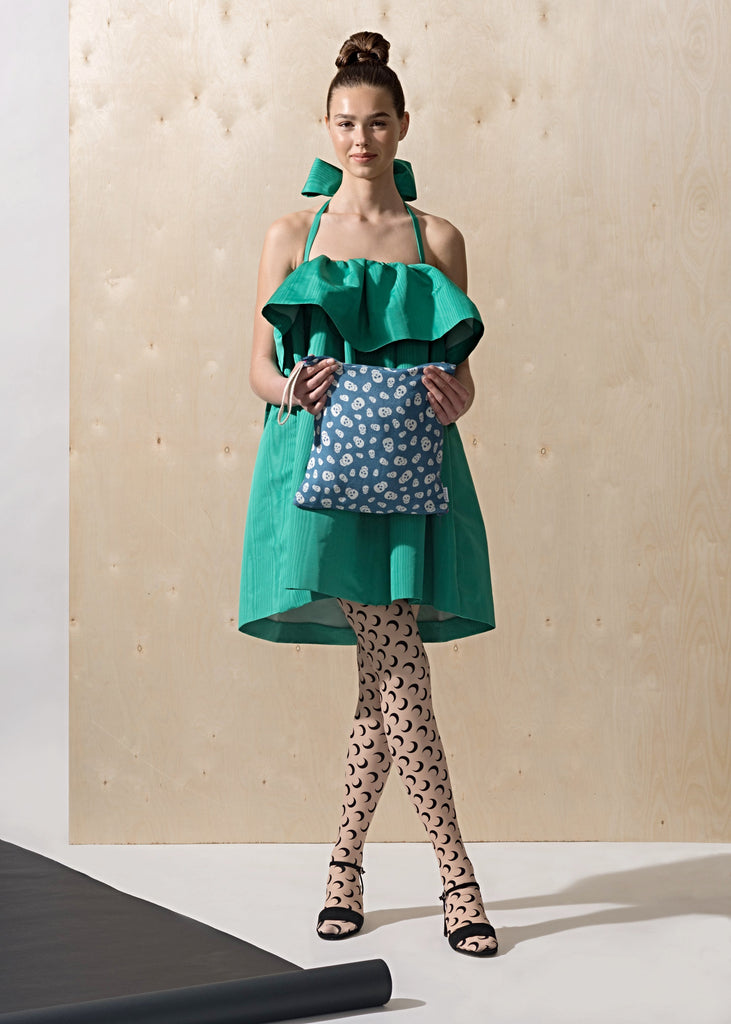 Model with SHOOFIE shoe bag in Denim & Skulls print